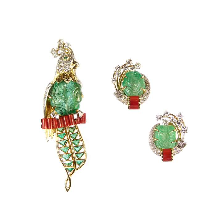 Carved emerald, diamond and corallium rubrum exotic bird brooch and earrings en suite